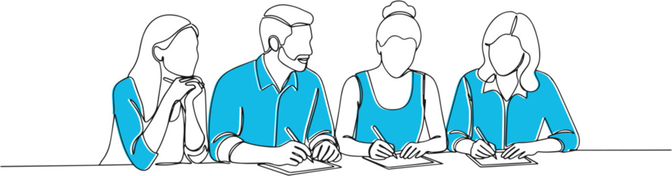 Four people sitting at table working.