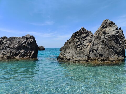 Volcanic rocks and crystal clear turquoise water Campi Flegrei Phlegrean Fields Naples Italy