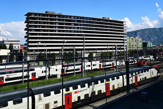 Geneva, Switzerland, Europe - 05.2026 : Swiss Stadler Electric multiple unit trains KISS RABe 511 at Geneve-Secheron station, Edgar et Dani&egrave;le de Picciotto Student House, Geneva Graduate Institute