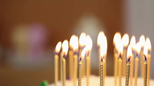 Close-up of birthday cake candles burning brightly. Celebrating special moments and creating joyful memories with friends and family