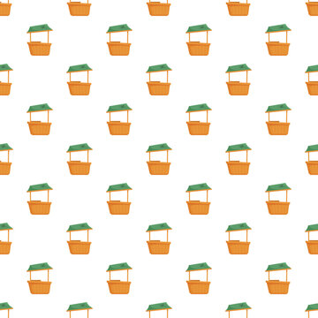 Seamless pattern featuring repeated market stalls with green roofs and wooden bases on a white background