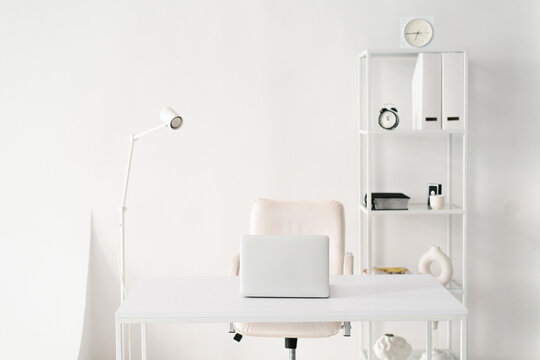Minimalist Total White Workspace with Laptop and Office Furniture