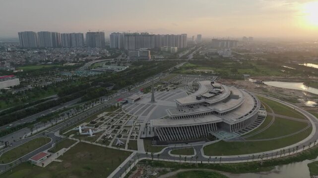 Aerial view of the Vietnam Military History Museum beside Thang Long Boulevard in Hanoi with modern architecture and surrounding urban development.