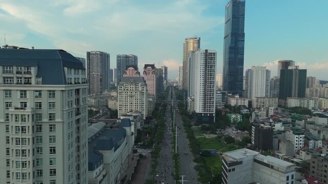 Aerial view of Me Tri Street approaching the Pham Hung intersection in Hanoi with modern high-rise buildings and dense urban development.