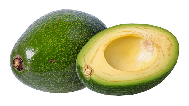Whole and halved ripe green avocado fruit with creamy yellow flesh