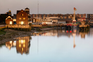 Fototapeta premium Sunrise and reflections on the River Thames, London 