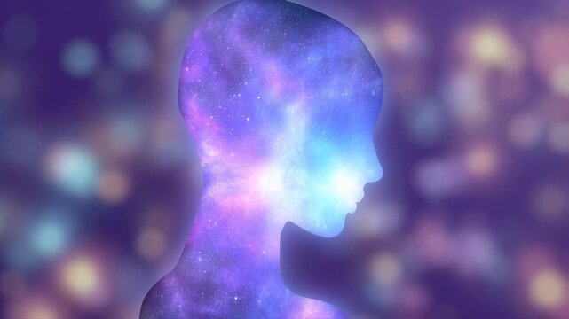 Ethereal silhouette of a human head filled with cosmic colors and stars. Represents the connection between humanity and the universe, exploring consciousness and imagination