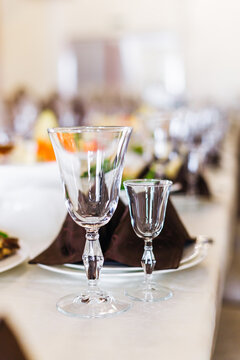 Elegant table setting with wine glasses at a wedding reception and formal dining celebration