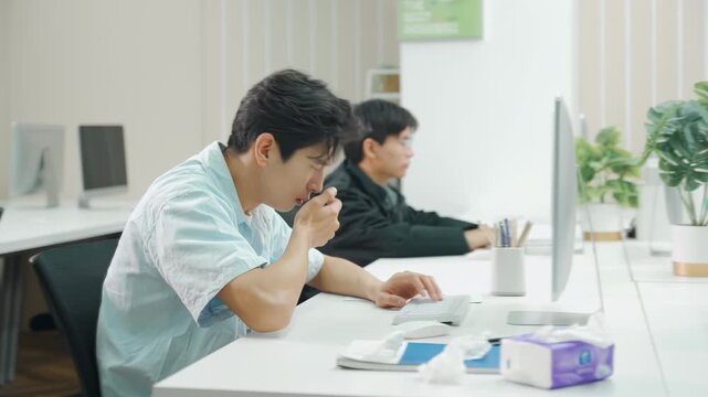 Stressed overwhelmed businessman sick and coughing in office, male worker experiencing workplace illness virus spread for infection, sinus cold symptoms, indicating fatigue potential viral infection