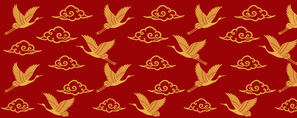 Fototapeta premium Traditional Chinese pattern with flying cranes and auspicious clouds in gold