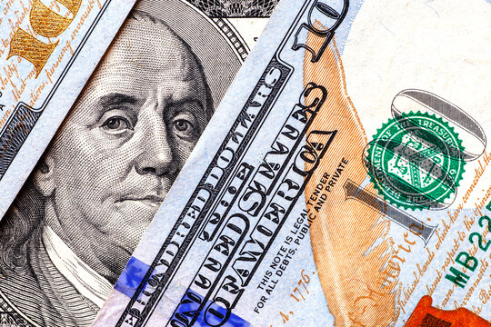 Money american hundred dollar bills.Closeup of assorted American banknotes.US currency scattered on the table.america currency dollor currency.World economic crisis associated with coronovirus.