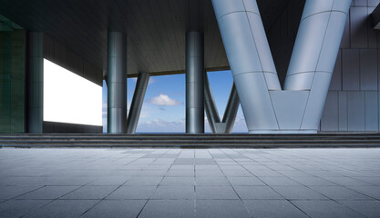 Naklejka premium Empty urban plaza with modern building columns and blank billboard