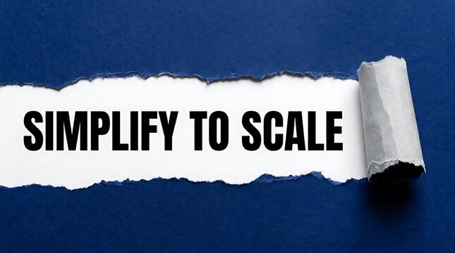 Simplify to scale business concept, torn paper revealing text on dark blue background, idea of growth and efficiency.