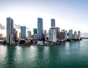 Fototapeta premium Aerial view of a coastal city skyline with sleek skyscrapers and calm waters
