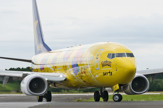 Ibaraki Airport, Japan - June 11, 2022: Skymark Airlines Boeing 737-800 (JA73AB) "Pikachu Jet BC1" Pokemon special livery taxiing, three-quarter view showing full fuselage and tail decoration