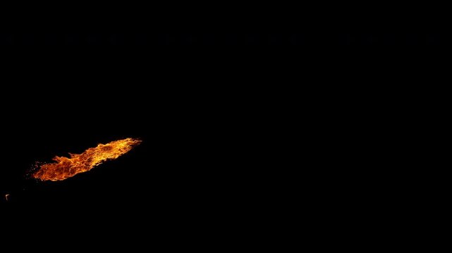 Super slow motion capture of a flickering fire flame isolated on a black background. High-speed footage reveals intricate combustion patterns, fluid motion, and glowing details.