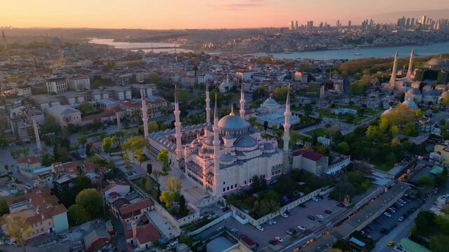 Istanbul cityscape with the iconic Sultan Ahmed Mosque and Hagia Sophia blending historical architecture with the modern Bosphorus skyline. speed ramp Amazing aerial view wide orbit panorama overview