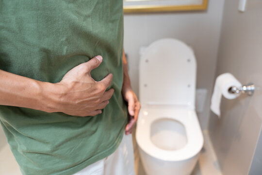Constipation and diarrhea in bathroom. Hurt man touch belly  stomach ache painful. colon inflammation problem, toxic food, abdominal pain, abdomen, constipated in toilet, stomachache, Hygiene