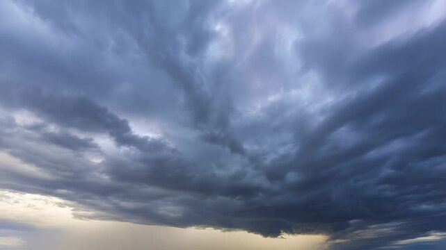 Dramatic cloud formations rolling across the sky at dusk. Capturing the beauty and power of nature's weather patterns