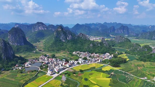  Autumn Rice Harvest in Karst Mountains, Golden Yellow Fields and Village Below