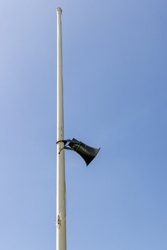 Loudspeaker Mounted On A Flag Pole At A Polo Ground