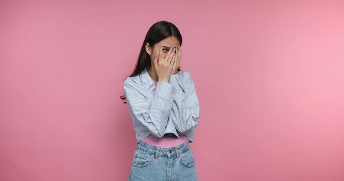 Emotions shown by a woman in four frames with different expressions on a pink background