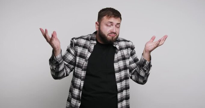 Man shows different reactions with gestures and body language in a studio setting