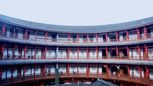 Traditional Chinese Circular Courtyard Building with Red Lanterns in China