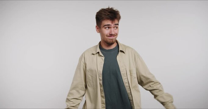 Person shows different gestures and expressions for teaching a concept in a studio setting