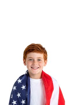 Cute American boy with red hair wearing United States flag as a cape with vertical white top copy space for 4th of July (Independence Day), Veterans Day, Memorial Day and holiday promotions