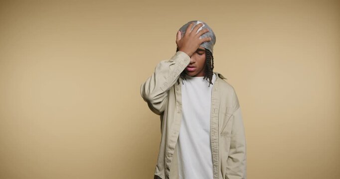 Young person shows different emotions and thoughts in four frames with simple background at indoor location