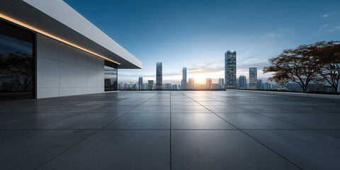 Obraz premium Terrace with tiled flooring, glass windows, overlooking city skyline at sunrise. Copy space ideal as background, commercial presentations, real estate marketing and corporate design projects.