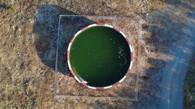 Aerial approach to a circular firefighting water reservoir