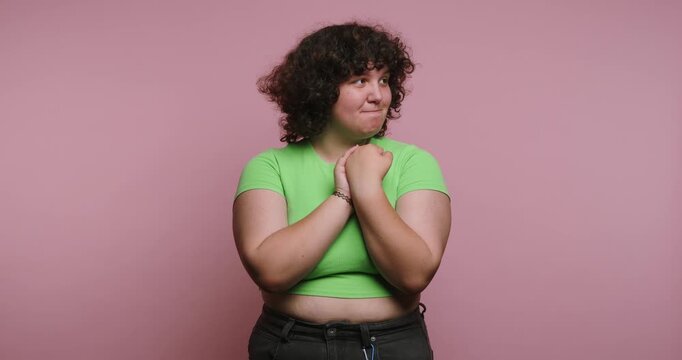 Woman shows different expressions and emotions in colorful setting during afternoon in studio