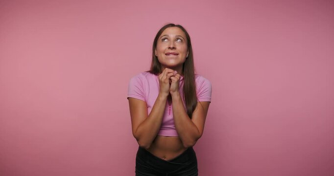 Smiling woman expresses joy and excitement in a photo session at an indoor studio