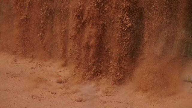 Grand Falls, Arizona as chocolate-colored water tumbles over the edge in slow motion.