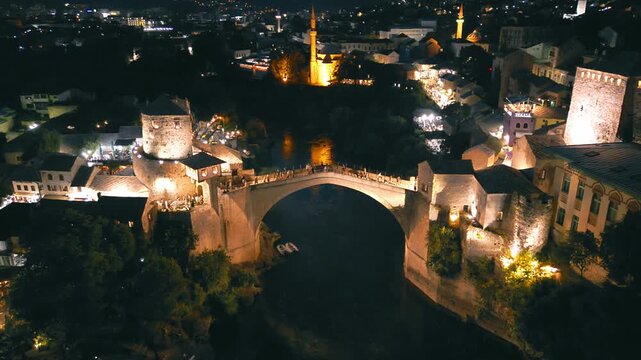 Drone footage at night of the bridge in Mostar, Bosnia