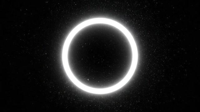 Bright white glowing ring light centered on a solid black background.