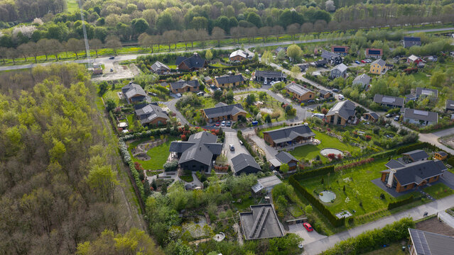 Aerial drone view of an ecovillage in Almere, showing sustainable homes, community living, green space and ecological design.