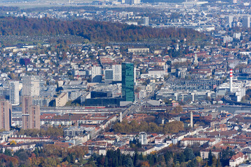 Fototapeta premium Aerial view of cityscape with Hardbrücke bridge and Prime Tower skyscraper at industrial district of Swiss city of Zürich on a sunny autumn day. Photo taken October 29th, 2025, Zurich, Switzerland.