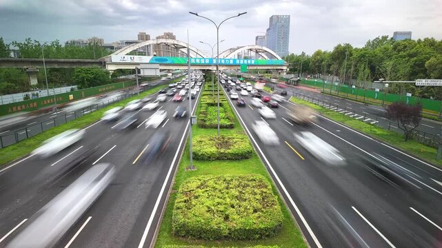 Busy Urban Highway Traffic Under Pedestrian Overpass in Shanghai China