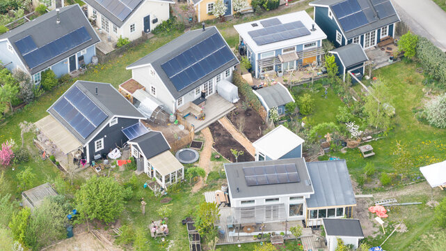 Aerial drone view of an ecovillage in Almere, showing sustainable homes, community living, green space and ecological design.