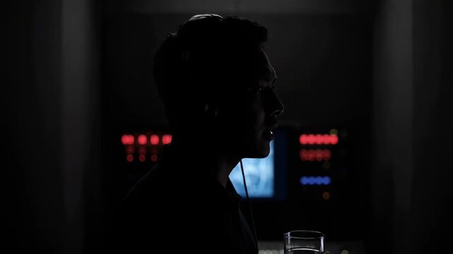 Dark mood headphones man portrait focus introspection cinematic atmosphere deep thought