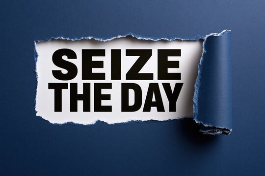 The words seize the day under a torn dark blue paper