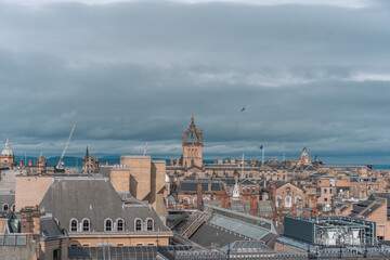Fototapeta premium Historic Old Town streets in Edinburgh, Scotland. Scenic view of ancient gothic architecture, cobbled alleyways and traditional Scottish culture.
