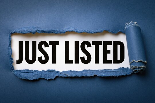 Just listed real estate notification hidden behind torn dark blue paper