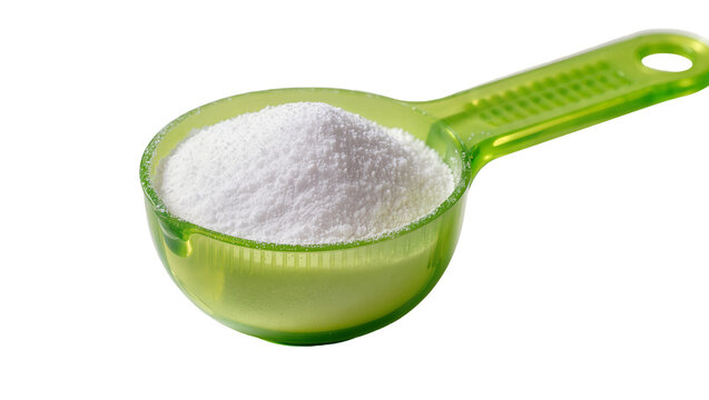 Green plastic measuring scoop filled with white powder