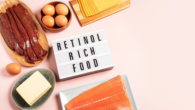 Flat lay border background of high vitamin A animal sources with retinol rich food text, copy space