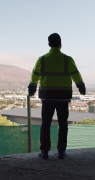 Back, architect and man with celebration at construction site, development achievement and winning. Property progress, project milestone and person with fist pump for building goal, space and victory