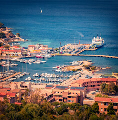 Colorful summer cityscape of Palau port, Province of Olbia-Tempio, Italy, Europe. Sunny afternoon scene of Sardinia island. Wonderful mediterranean seascape. Traveling concept background. © Andrew Mayovskyy